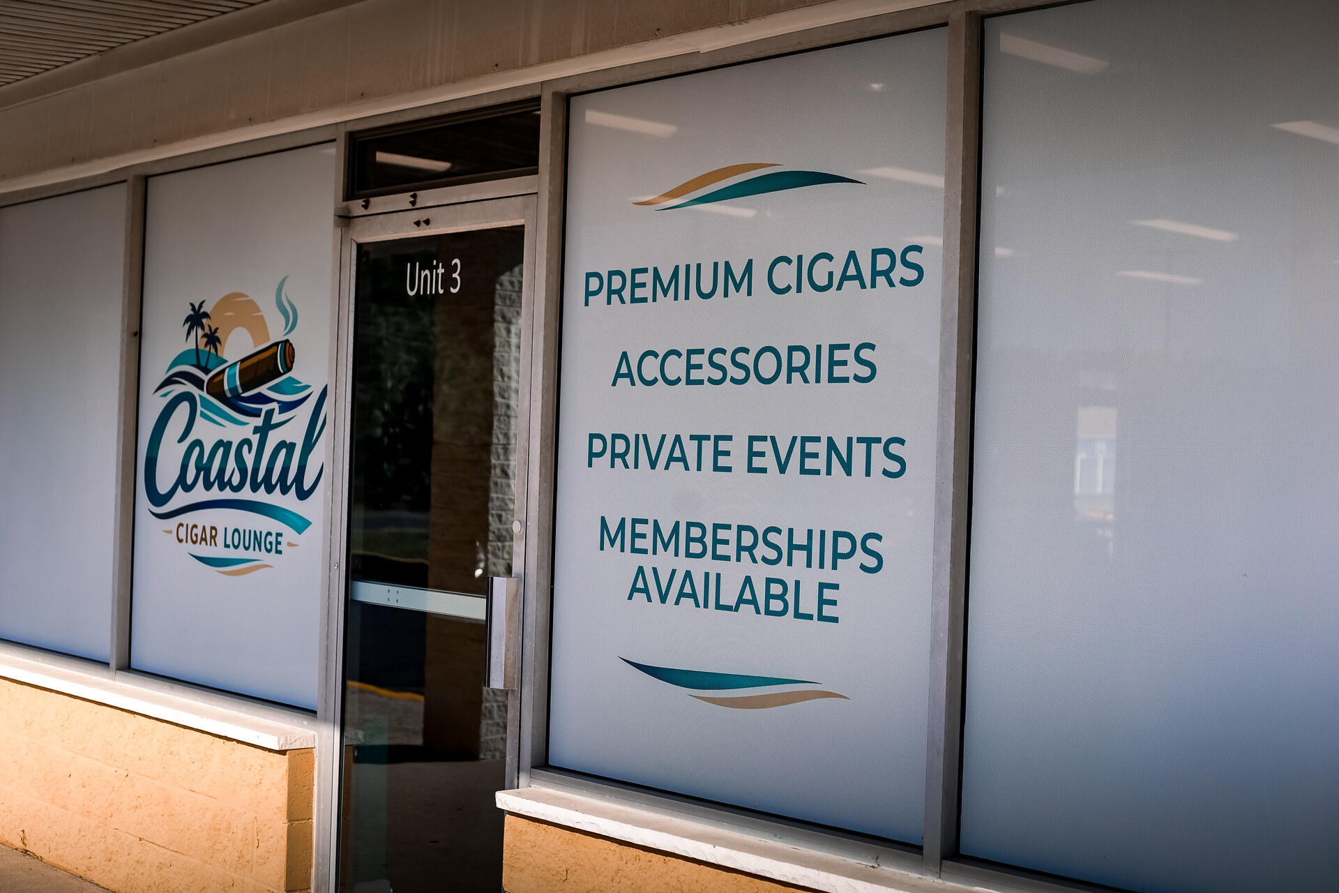 Coastal Cigar Lounge storefront and Unit 3 lounge entrance on Bayshore Road