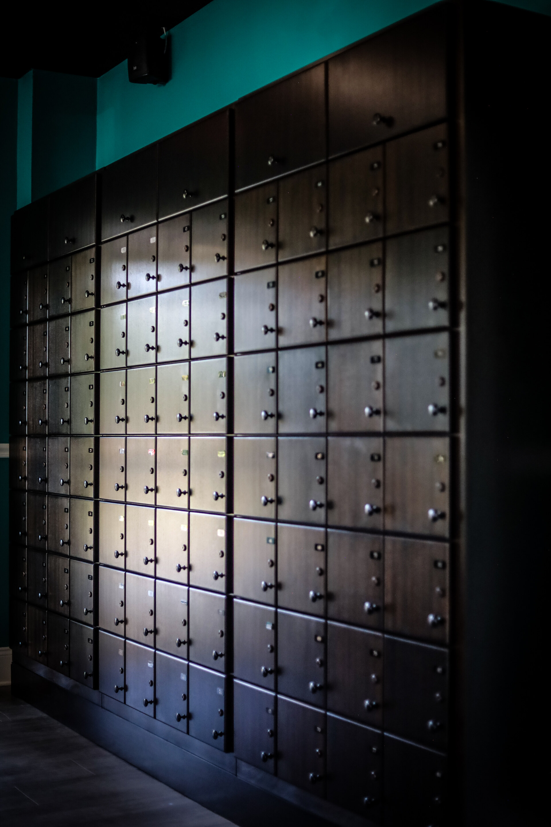 Wooden lockers along the aqua lounge wall