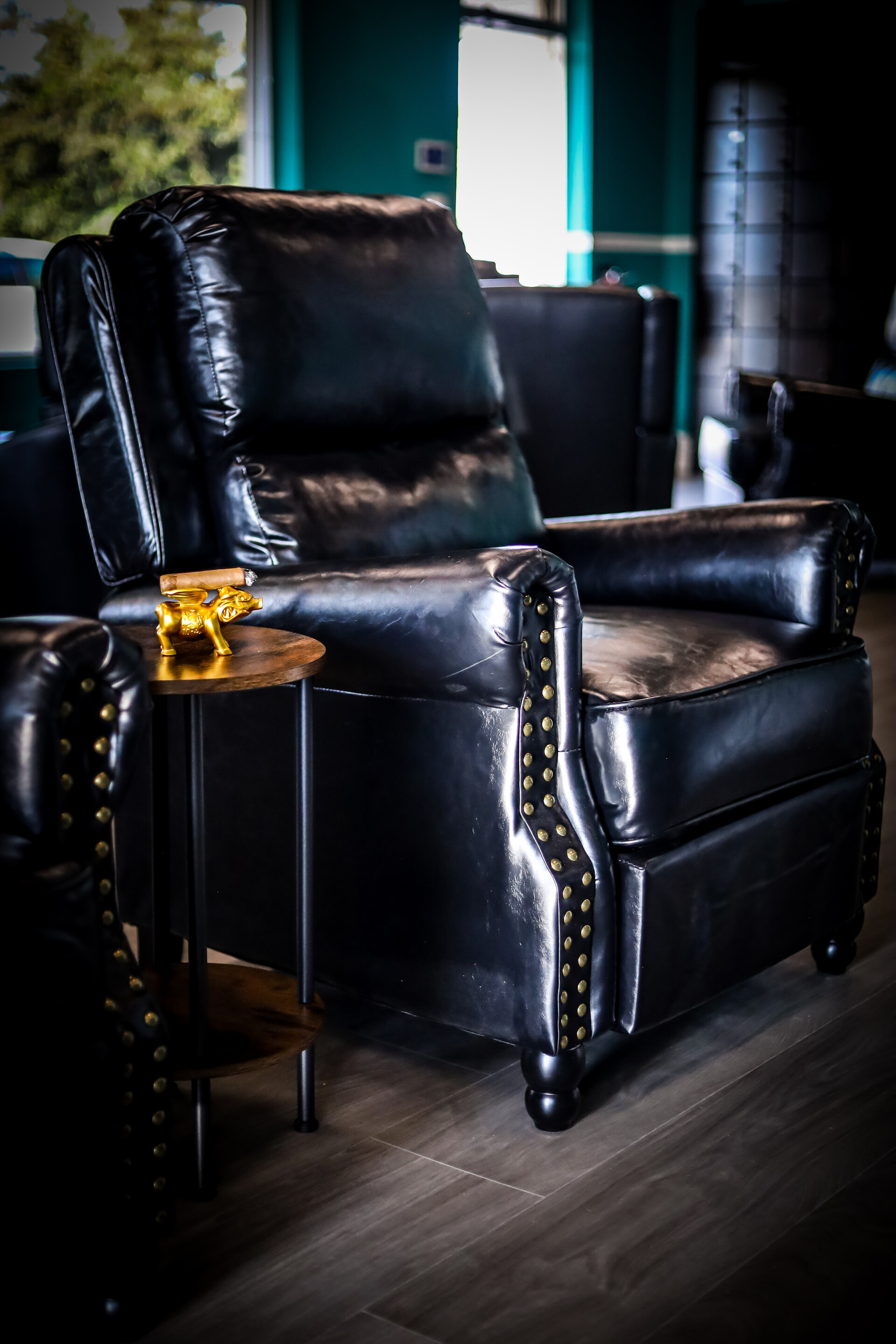 Leather armchair beside a small cigar table